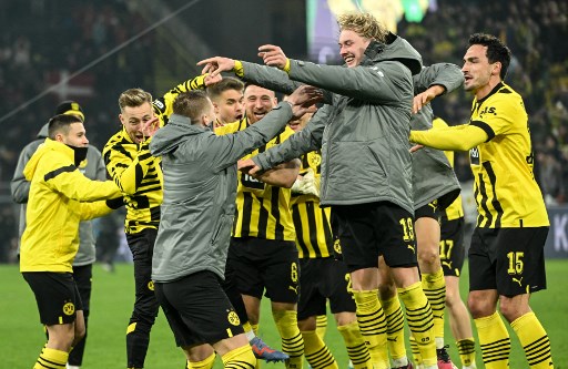 Selebrasi kemenangan para pemain Borussia Dortmund. (INA FASSBENDER / AFP)