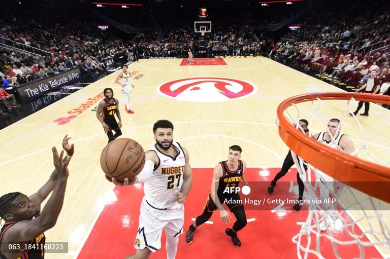 Guard Denver Nuggets, Jamal Murray, mencetak angka ketika menghadapi Atlanta Hawks (AFP/Adam Hagy)