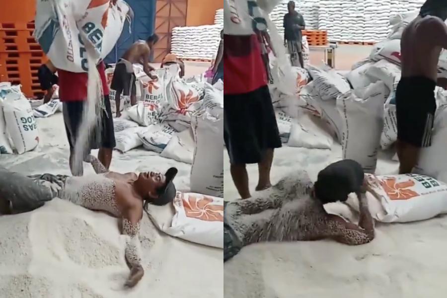 Seorang pria 'mandi' beras Bulog. Foto: tangkapan layar