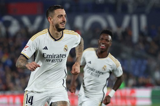 Striker Real Madrid Joselu merayakan golnya ke di markas Getafe. (Pierre-Philippe MARCOU / AFP)