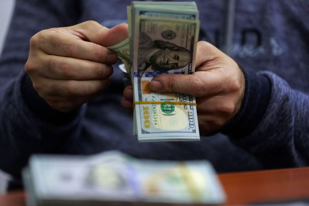 Dolar AS. Foto: AFP/Ahmad Al Rubaye.