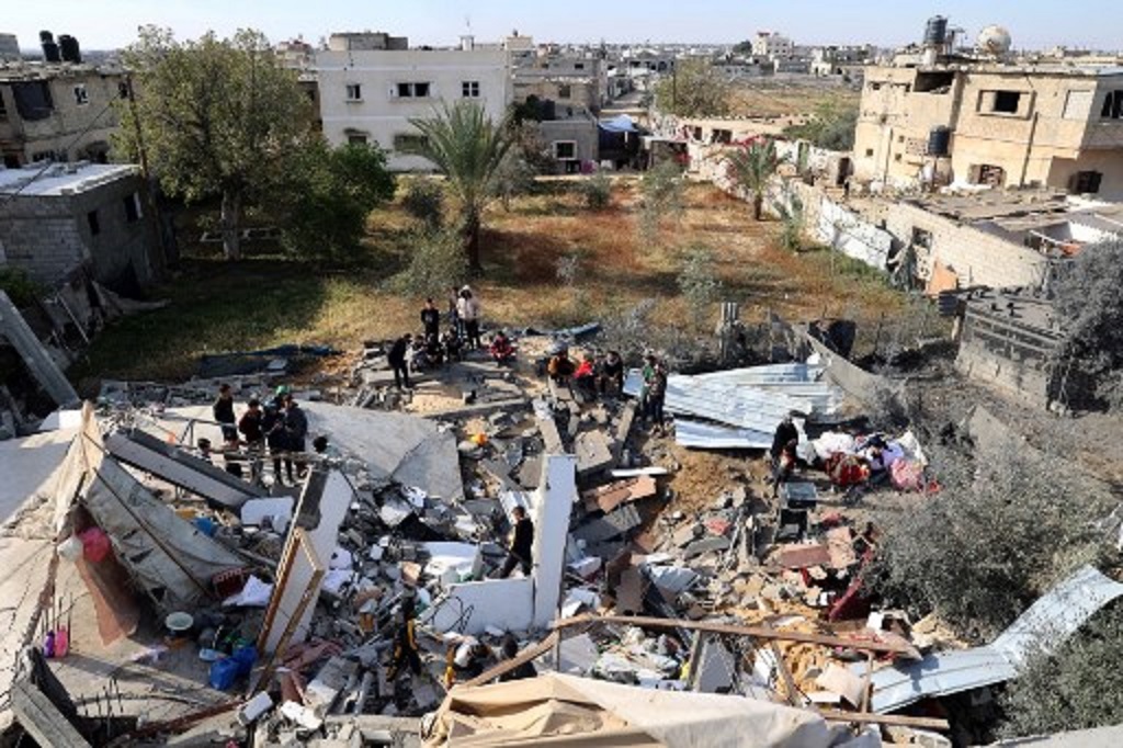 Kehancuran akibat serangan udara Israel di Gaza, 23 Maret 2024. (SAID KHATIB / AFP)