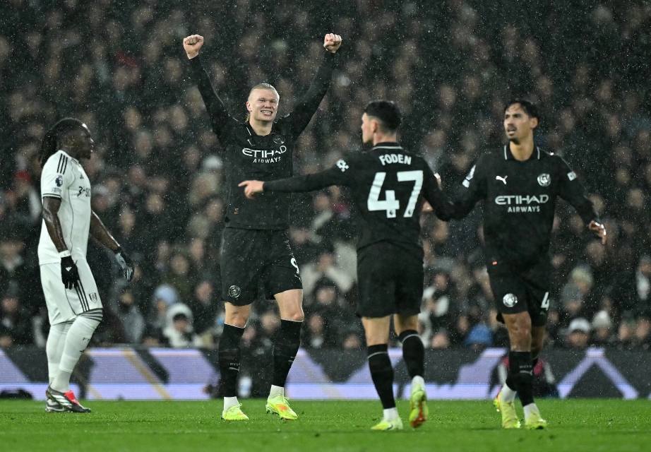 Pemain Manchester City merayakan kemenangan atas Fulham (AFP/Ben Stansall)
