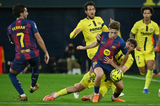 Suasana laga Villarreal vs Barcelona. (Foto: JOSE JORDAN / AFP)