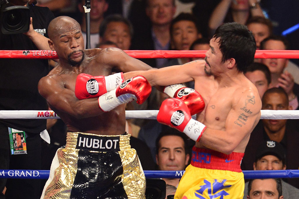 Mayweather Pertahankan Sabuk Juara dari Pacquiao