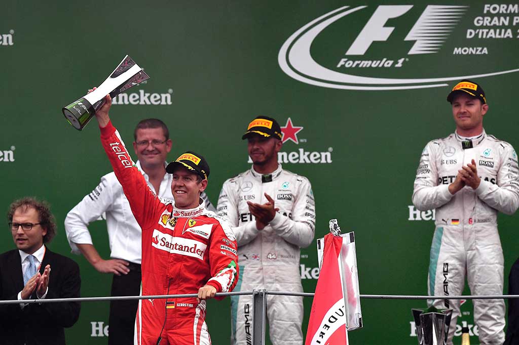 Pembalap Ferrari Sebastian Vettel dan Kimi Raikkonen mencapai finis di posisi ketiga dan keempat pada balapan di negara timnya tersebut.