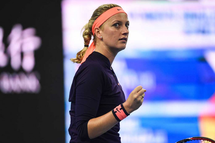 Kvitova melakukan selebrasi usai menundukkan Muguruza dua set langsung.