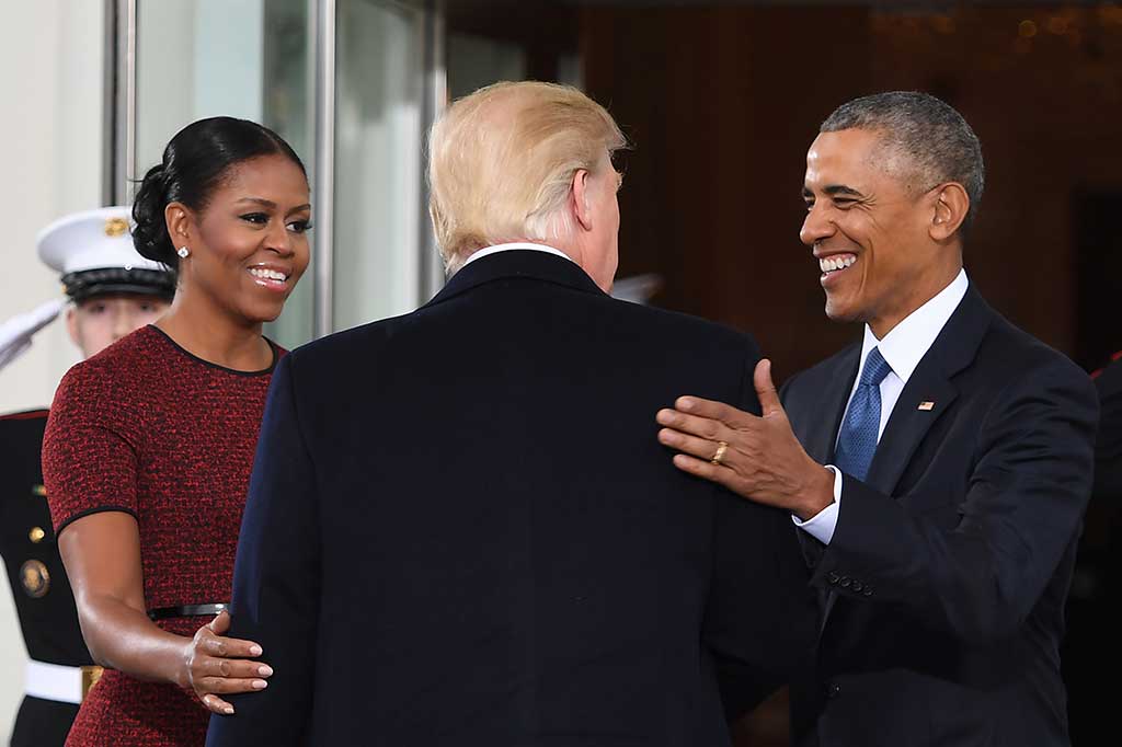 Obama dan Michelle menyambut Trump. AFP/Jim Watson