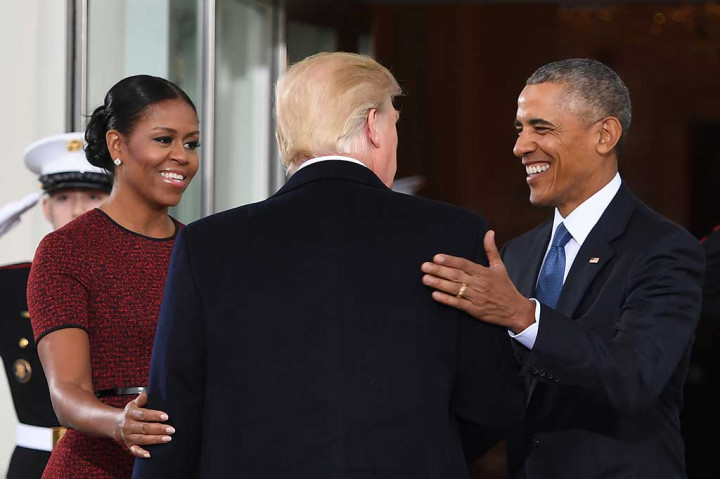 Obama dan Michelle menyambut Trump. AFP/Jim Watson