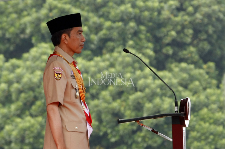 Presiden Jokowi menyampaikan pidatonya di depan 15 ribu peserta upacara Peringatan Hari Pramuka ke-56 dan Pembukaan Raimuna Nasional XI Gerakan Pramuka di Bumi Perkemahan Cibubur, Jakarta Timur. 