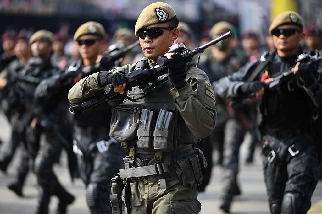 Anggota pasukan khusus Malaysia dan unit taktis kontra terorisme (PPAT 69) ambil bagian dalam perayaan HUT ke-60 Malaysia.