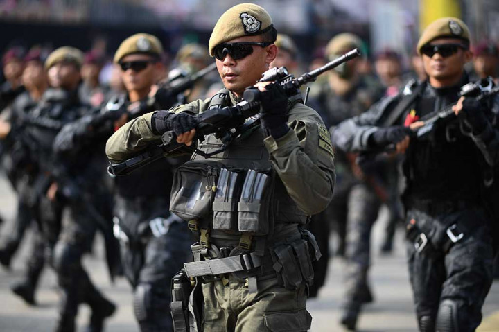 Anggota pasukan khusus Malaysia dan unit taktis kontra terorisme (PPAT 69) ambil bagian dalam perayaan HUT ke-60 Malaysia.