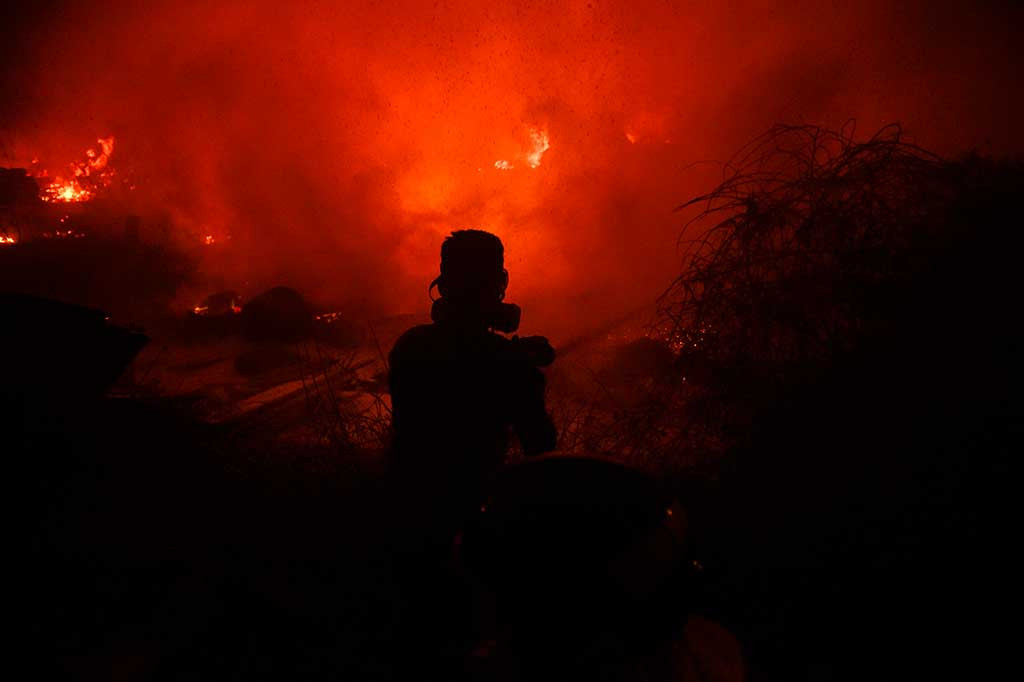 Musibah kebakaran juga terjadi di Spanyol. Korban tewas akibat kebakaran di kedua negara tersebut sebanyak 36 orang, tiga di antaranya di Spanyol. Sementara tujuh orang masih hilang, yang juga melukai setidaknya 63 orang, termasuk 16 orang kritis. AFP/Miguel Ropa