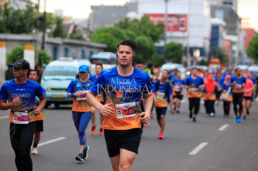 Tidak hanya warga lokal, warga negara asing juga turut serta berpartisipasi dalam lomba lari Heritage Run 2018 di Kawasan Kota Tua, Jakarta. MI/Rommy Pujianto