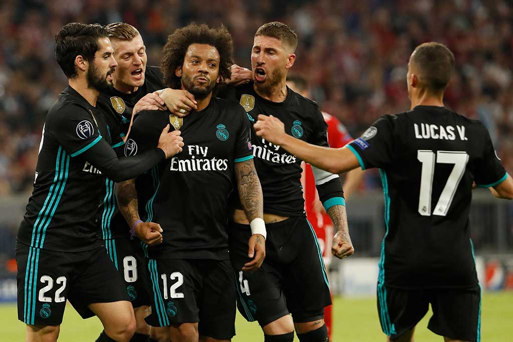 Real, yang mengincar gelar untuk ketiga kalinya secara beruntun, akhirnya berhasil menyamakan kedudukan lewat Marcelo pada menit ke-44. AFP/Odd Andersen