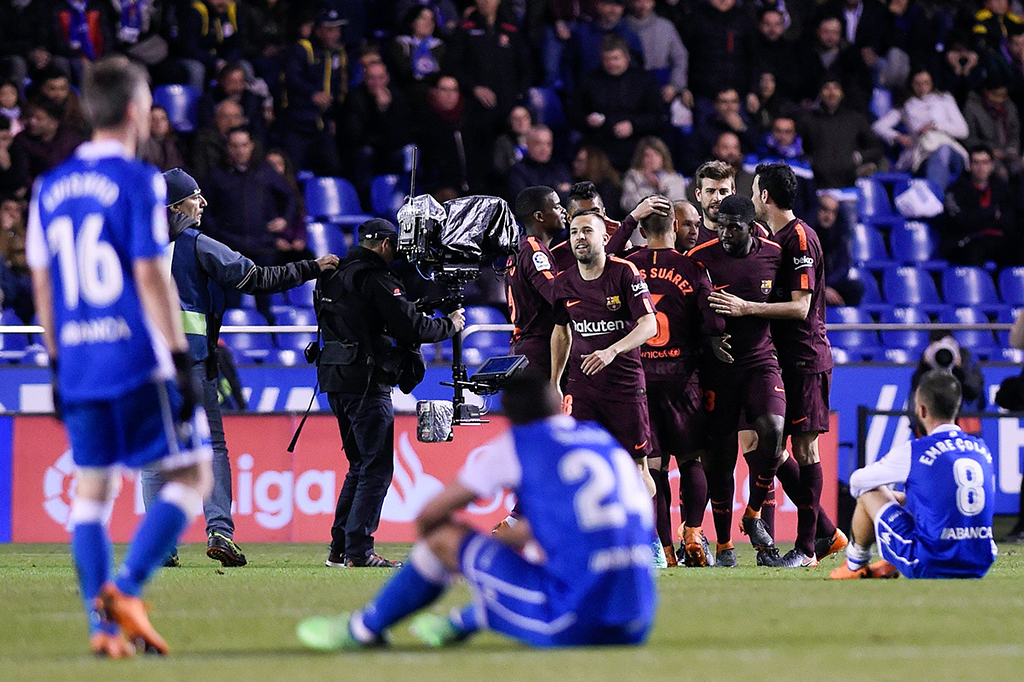 Sementara buat La Coruna, kekalahan ini memastikan mereka terdegradasi ke divisi Segunda A. AFP/MIGUEL RIOPA