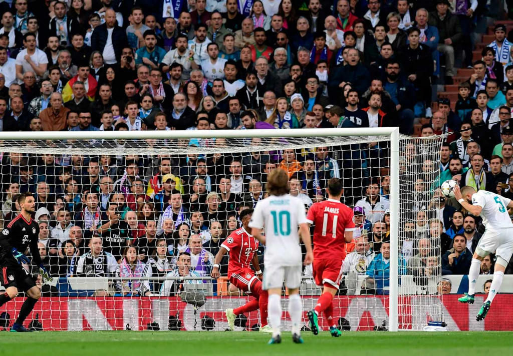 Namun Karim Benzema berhasil menyamakan kedudukan melalui tandukan menyambut umpan silang Marcelo pada menit ke-11. AFP/Javier Soriano