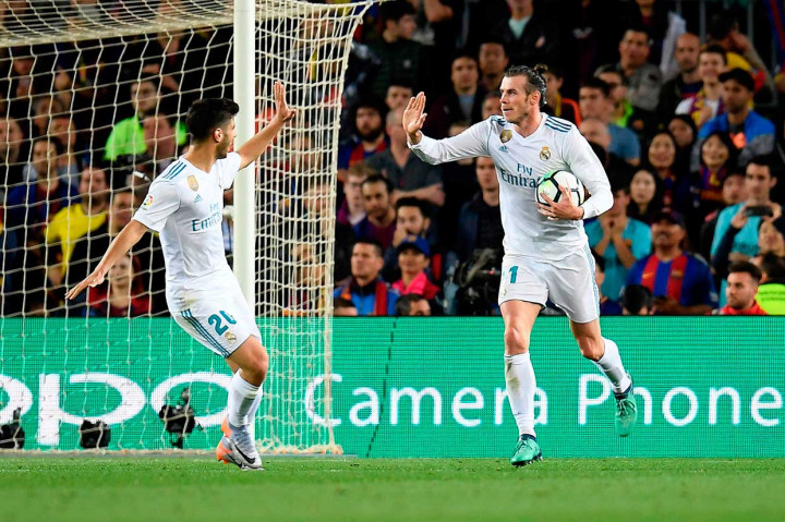 Menit ke-72 Madrid berhasil menyamakan kedudukan menjadi 2-2 lewat tembakan melengkung Gareth Bale. AFP/LLUIS GENE