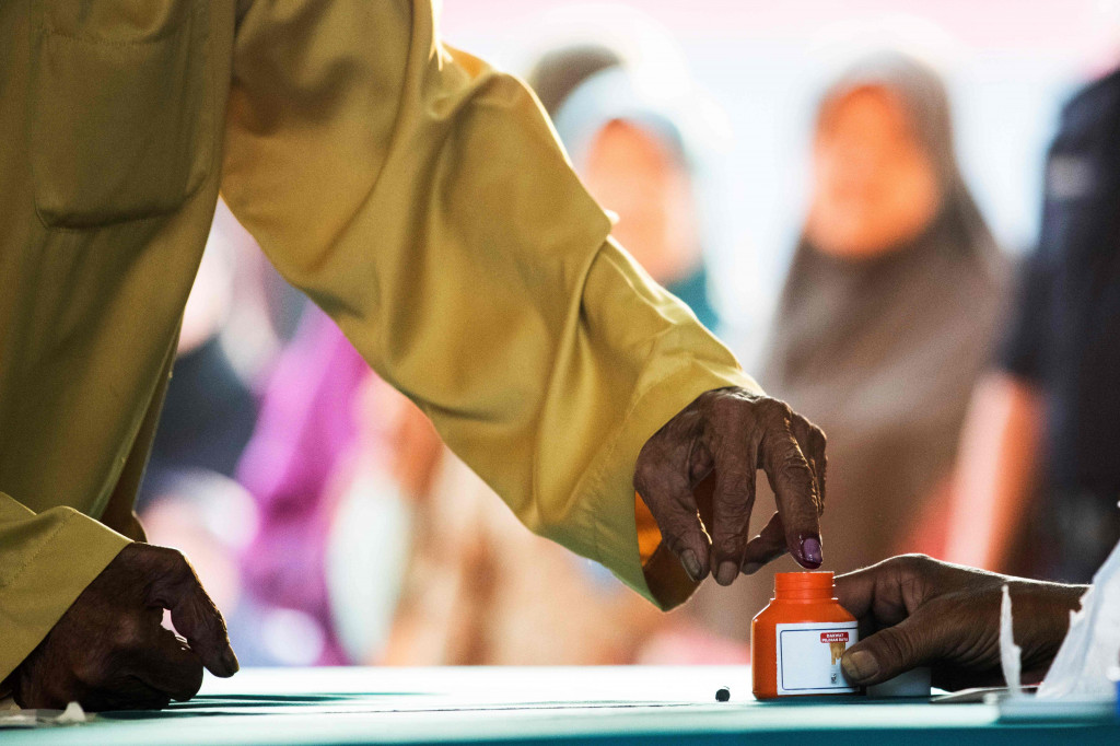 Pemerintah federal Malaysia menyatakan hari ini sebagai hari libur nasional untuk memberi kesempatan bagi seluruh pemilih berpartisipasi dalam Pemilu 2018. AFP/JEWEL SAMAD