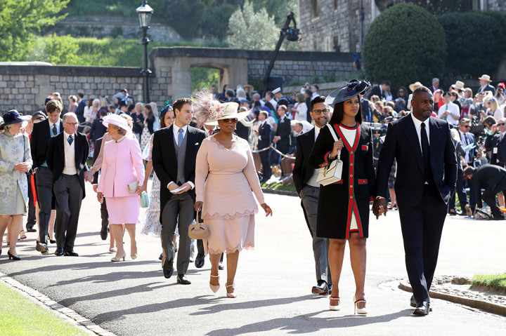 Di antara tamu undangan yang hadir dalam upacara pernikahan kerajaan tersebut terlihat sejumlah selebriti seperti Oprah Winfrey, George dan Amal Clooney, David dan Victoria Beckham, dan Elton John. AFP PHOTO / POOL / Chris Radburn