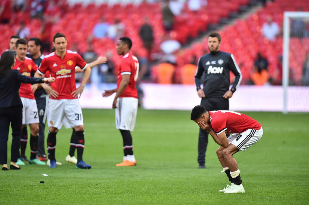 Sementara bagi Man United, musim ini harus berakhir tanpa gelar karena gagal di tiga kompetisi lainnya. AFP/GLYN KIRK 
