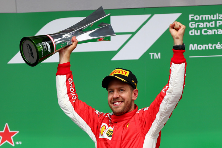 Sebastian Vettel kembali memimpin klasemen sementara F1 2018, menyalip rival terberatnya, Lewis Hamilton. Afp Photo/Dan Istitene