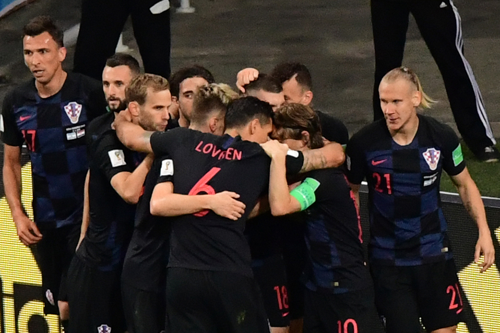 Dengan hasil ini, Kroasia memimpin klasemen sementara Grup D dengan koleksi enam poin, sekaligus meraih tiket ke babak 16 besar. Afp Photo/Martin Bernetti
