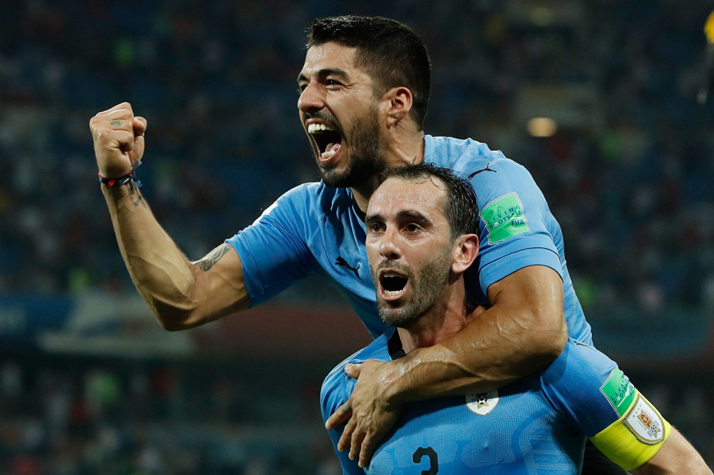 Skor 2-1 untuk keunggulan Uruguay bertahan hingga laga berakhir. Afp Photo/Odd Andersen