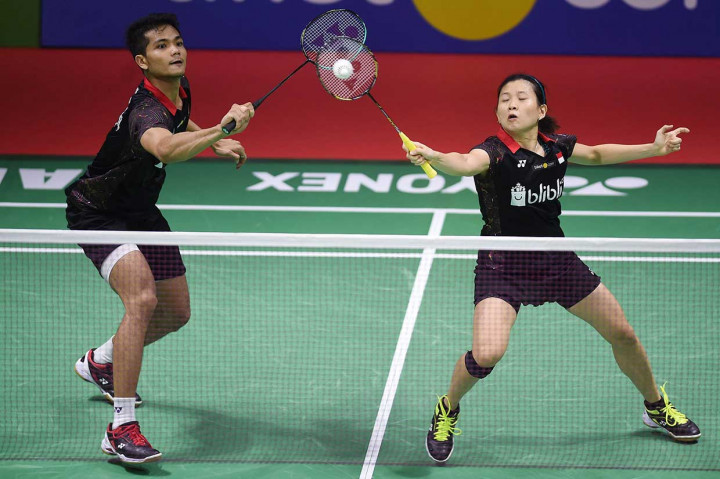Ricky/Debby berhasil memastikan tiket ke perempat final setelah menang 2 gim langsung dengan skor 21-14 dan 21-19.
