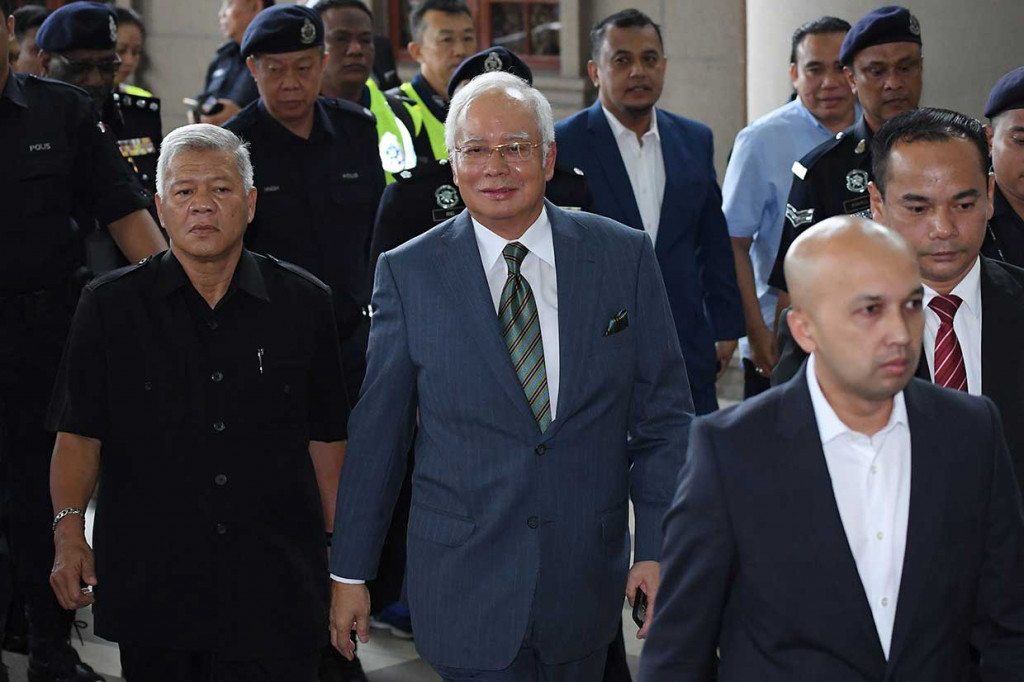 Mantan Perdana Menteri Malaysia Najib Razak tiba untuk menghadiri sidang di kompleks pengadilan Duta di Kuala Lumpur pada 8 Agustus 2018.