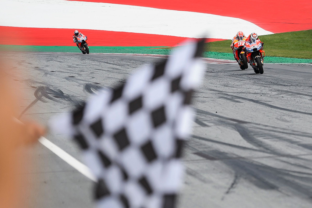 Rider asal Spanyol itu finis terdepan setelah memenangi duel melawan jagoan Repsol Honda, Marc Marquez. Afp Photo/Jure Makovec