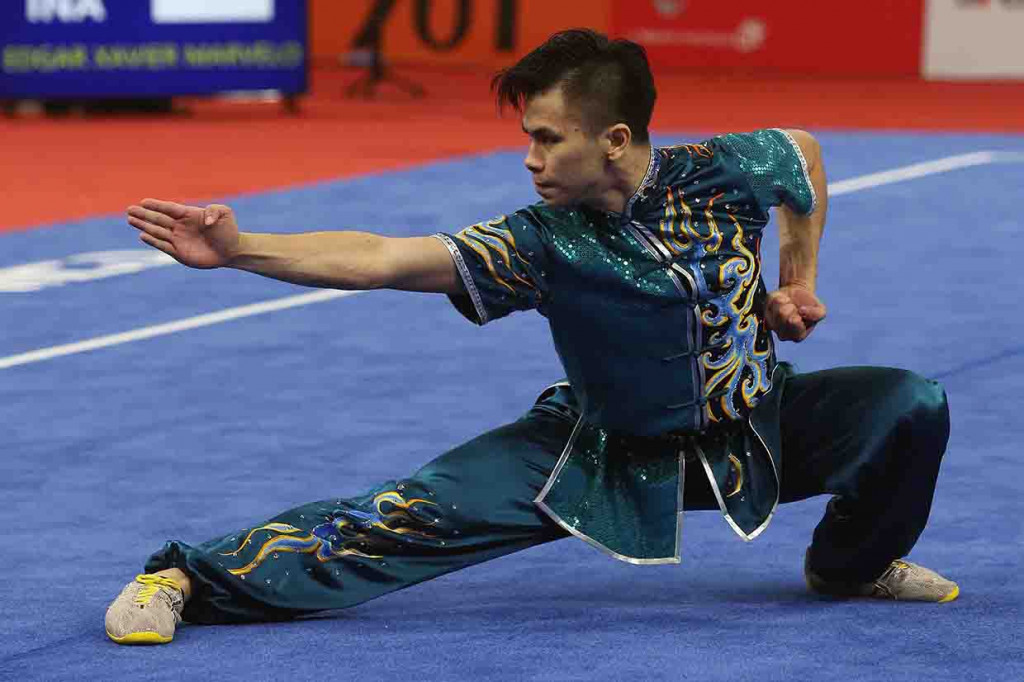 Atlet Wushu Indonesia Edgar Xavier Marvelo saat tampil di nomor Chanquan Putra pada Asian Games 18 di JEXPO, Kemayoran, Jakarta. 
INASGOC/Antara Foto/Gino F Hadi