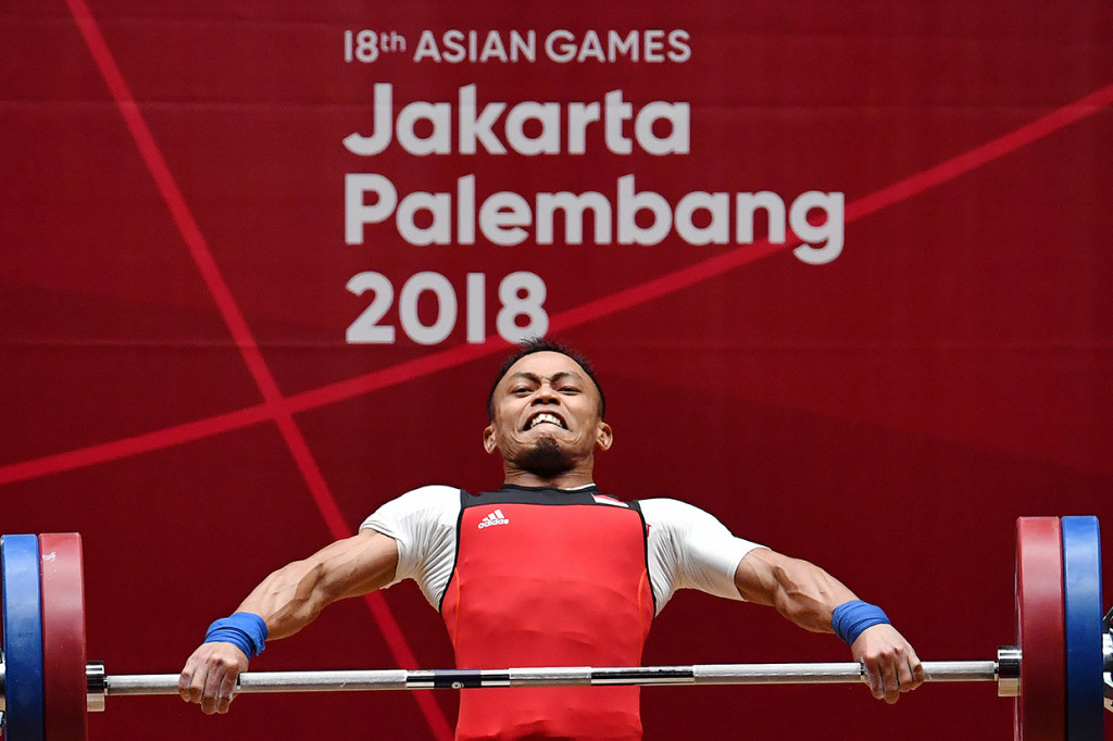 Surahmat meraih medali perunggu pada angkat berat 56kg putra Asian Games 2018. Dia membukukan total angkatan 272 kg (Snatch 119 kg, Clean and Jerk 153 kg). Antara Foto/INASGOC/Fanny Octavianus