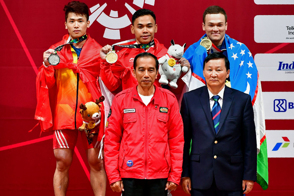 Sumbangan medali emas dari Eko Yuli Irawan merupakan emas kelima yang didapat Merah Putih pada ajang Asian Games 2018. Afp Photo/Money Sharma