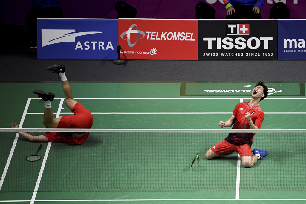 Aksi pebulu tangkis ganda putra Indonesia Kevin Sanjaya Sukamuljo dan Marcus Fernaldi Gideon setelah berhasil mengalahkan pebulu tangkis Indonesia Muhammad Rian Ardianto dan Fajar Alfian pada pertandingan babak final ganda putra Bulu Tangkis Asian Games 2018. Antara Foto/INASGOC/Ismar Patrizki