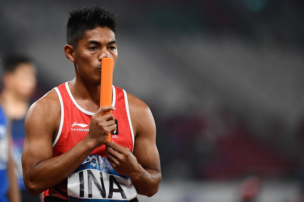 Indonesia menurunkan Fadlin sebagai pelari pertama. Sejak orang pertama itu, Indonesia sudah meyakinkan dengan ada di urutan kedua. Afp Photo/Jewel Samad