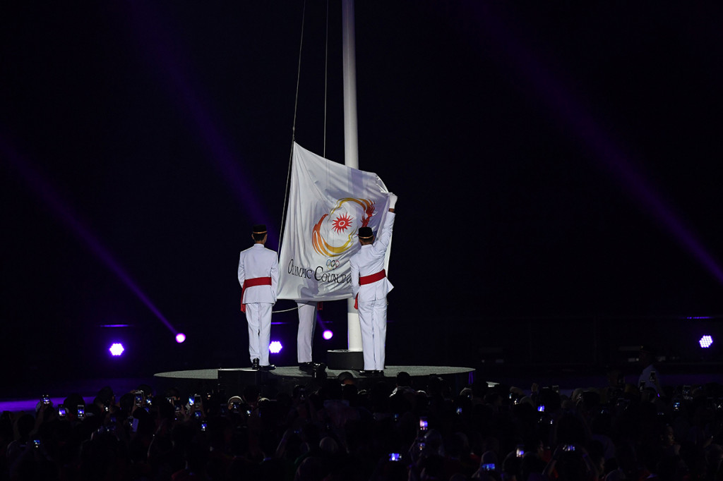 Acara puncak penutupan Asian Games 2018 akan dilakukan secara simbolis dengan penurunan bendera OCA. Afp Photo/Goh Chai Hin