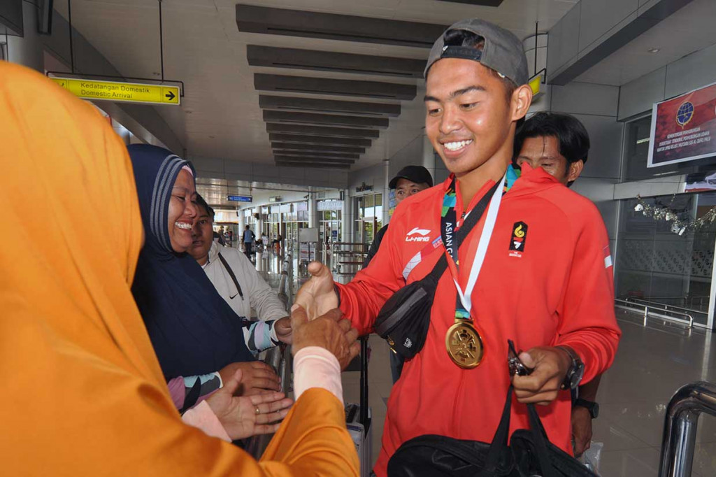 Sementara peraih emas termuda asal Indonesia adalah Rio Rizki Darmawan. Atlet dayung tersebut meraih emas di usia 15 tahun. Rio lahir pada 11 Februari 2003. INASGOC/Antara Foto/Mohamad Hamzah