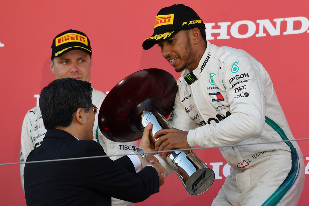 Kemenangan itu kian mendekatkan Hamilton ke gelar juara dunia F1 2018. Afp Photo/Toshifumi Kitamura