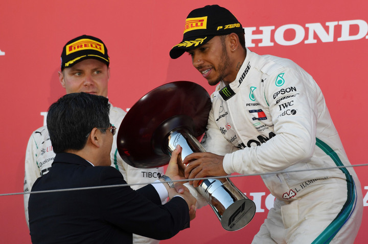 Kemenangan itu kian mendekatkan Hamilton ke gelar juara dunia F1 2018. Afp Photo/Toshifumi Kitamura