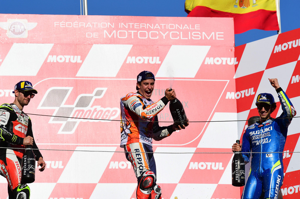 Pembalap Repsol Honda, Marc Marquez, melakukan selebrasi di atas podium setelah memenang GP Jepang di Twin Ring Motegi.