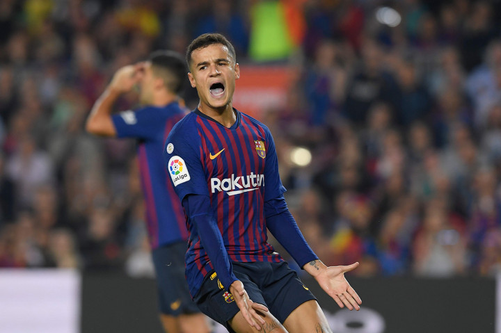 Philippe Coutinho melakukan selebrasi usai mencetak gol ke gawang Sevilla saat laga baru berjalan dua menit.