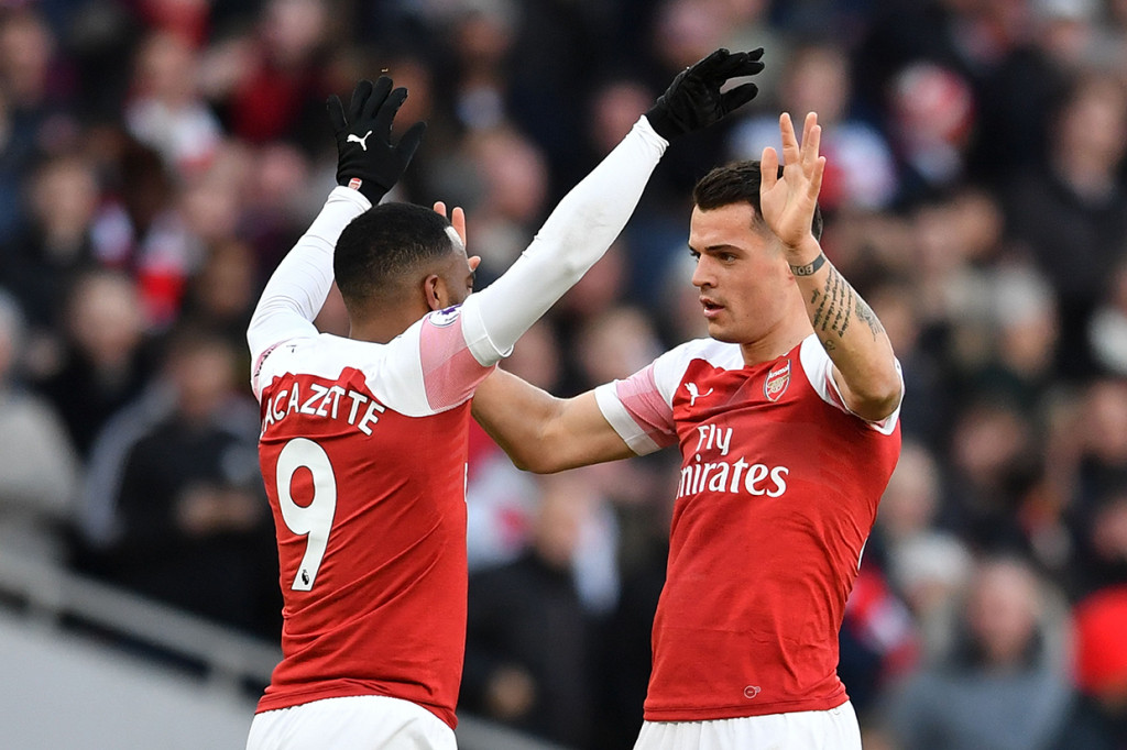 Dua gol Arsenal masing-masing dicetak oleh Granit Xhaka pada menit ke-12 dan Pierre-Emerick Aubameyang melalui titik penalti pada menit ke-69. Afp Photo/Ben Stansall