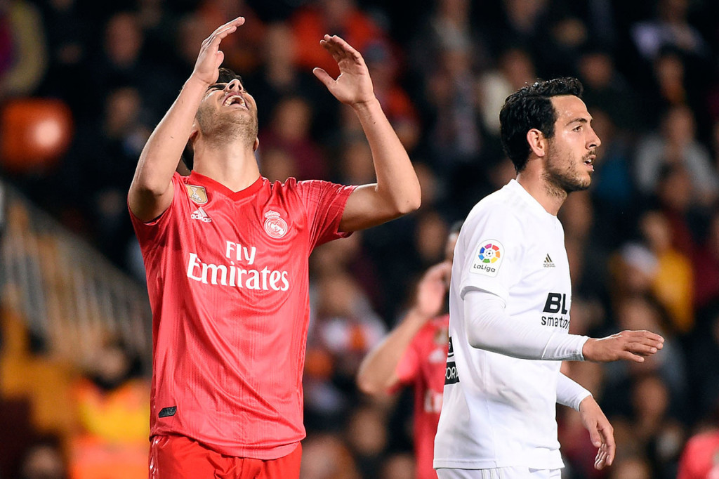 Gelandang Madrid Marco Asensio kecewa setelah tidak dapat memaksimalkan peluang yang dia dapat.