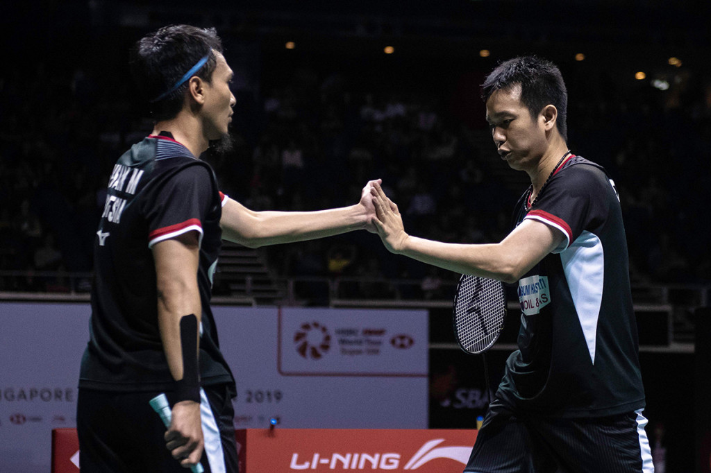 Dengan kekalahan ini, Hendra/Ahsan gagal meraih gelar Singapura Terbuka untuk keempat dalam karier mereka. Sekaligus gagal menambah koleksi gelar di tahun 2019 usai memenangi All England pada Maret lalu. Afp Photo/Theodore LIM
