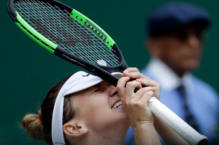 Ekspresi Simona Halep saat memenangkan nomor tunggal putri Wimbledon 2019. Afp Photo/Ben Curtis 
