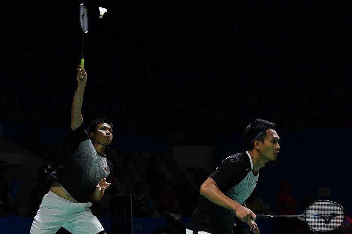 Hendra dan Ahsan berhasil melaju ke perempat final setelah menang 21-16, 21-17.