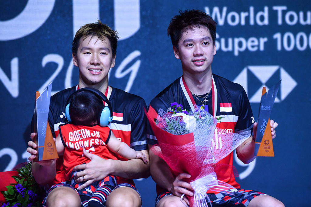 Ganda putra Kevin Sanjaya Sukamuljo/Marcus Fernaldi Gideon mempertahankan gelar turnamen Indonesia Open usai menaklukkan rekan senegaranya Mohammad Ahsan/Hendra Setiawan, Minggu, 21 Juli 2019. AFP Photo/Adek Berry