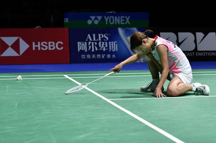Ekspresi tunggal putri Jepang Nozomi Okuhara setelah dikalahkan Pusarla Venkata Sindhu di laga puncak Kejuaraan Dunia Bulu Tangkis 2019.