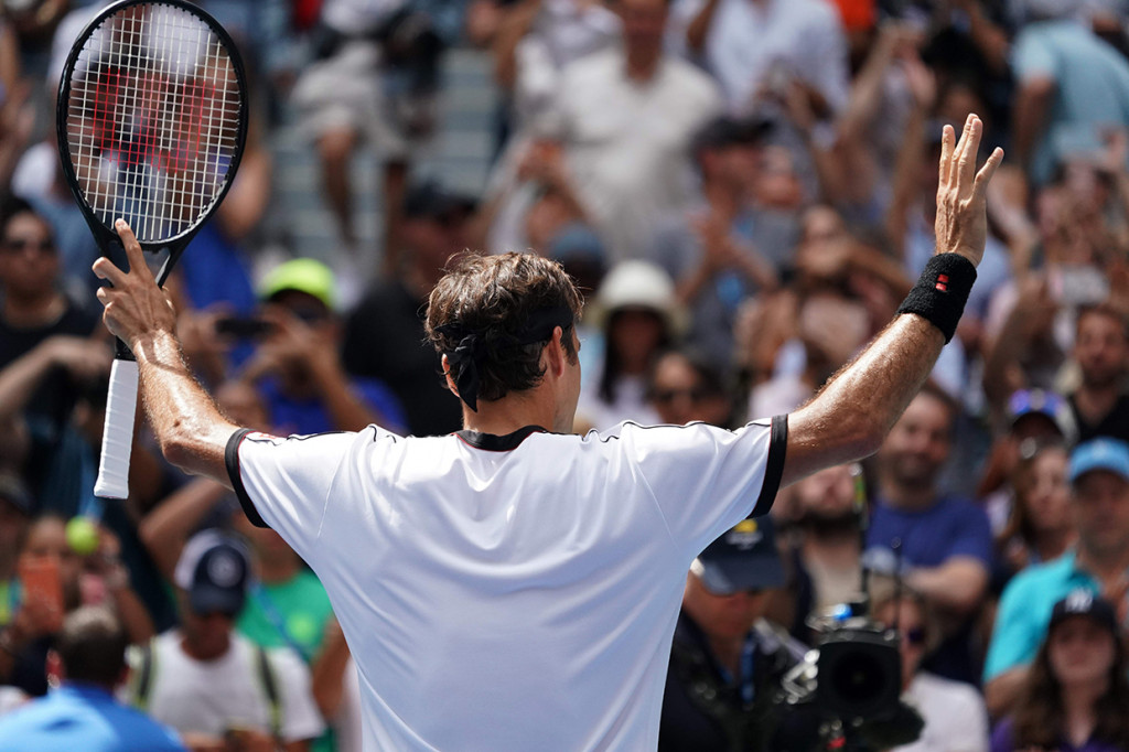 Kemenangan ini mengantarkan Federer menuju perempat final US Open untuk kali ke-13 dalam kariernya dan menyamai rekor Andre Agassi. Afp Photo/Timothy A.Clary